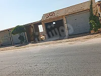 ارض للبيع مساحتها 1000متر اربع محلات واجهه ع الطريق العام مع مدخل 