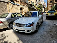 سيارة كيا سيراتو 2009 للايجار في حلب - أوتوماتيك وأبيض