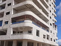 للبيع شقة سكنية على الهيكل اكساء حجر خارجي في مشروع توسع العاشر