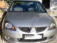ميتسوبيشي لانسر 2006 لون دهبي، كامل، خالية جوى وسقف وبرى عدا قطعتين