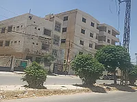 شقق للبيع دوار العسالي بجانب مشفى. الهدى الشارع الرئيسي 