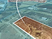 ارض للبيع على استراد حلب اللاذقية شمال سراقب بـ2كم